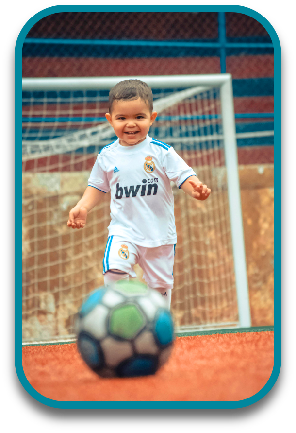 happy boy playing soccer